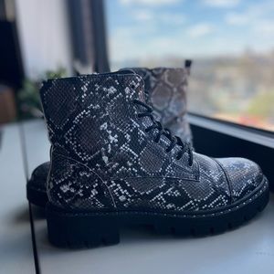 Faux-snake skin combat boots.